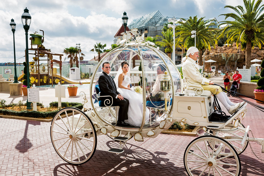 Christina, 21, en route to her wedding in Cinderella’s glass coach, Walt Disney World, Orlando, Florida, 2013. © Lauren Greenfield/INSTITUTE
