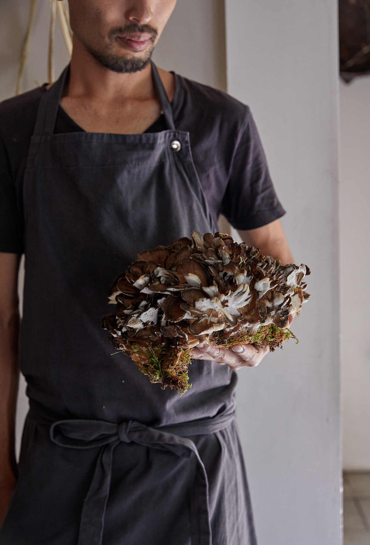 Yoshihiro Imai with a maitake mushroom, from monk. All photographs by Yuka Yanazume