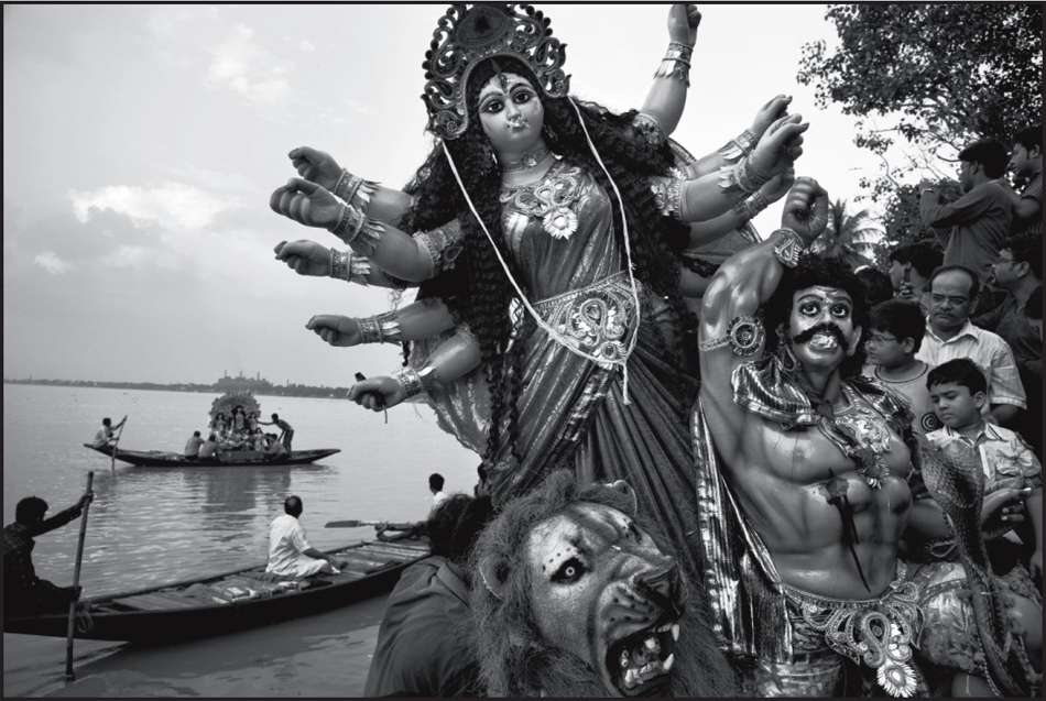 Abbas. Devotees drown a statue of Durga, the Bengali avatar of goddess Kali, in the river Hoogly; Kolkata, India. © Abbas / Magnum Photos