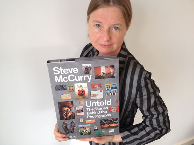 Phaidon publisher and editorial director Amanda Renshaw with a copy of Steve McCurry Untold