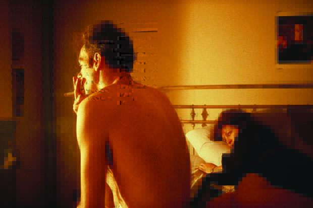 Nan and Brian in Bed, NYC, 1983, by Nan Goldin