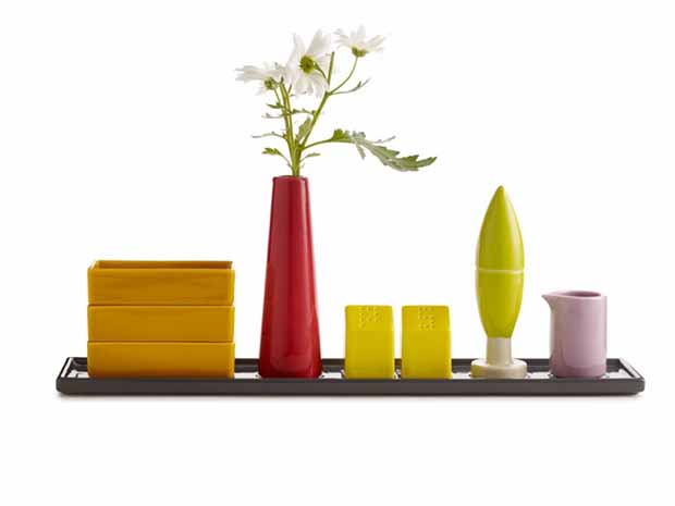 Condiment Architecture by Aldo Cibic. Cibic's a condiment-holder collection was inspired by the Italian countryside. The Cypress-tree holds toothpicks, the houses are salt and pepper shakers and the smokestack is a vase.