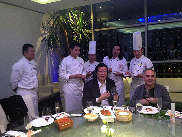 Adrià enjoying a suckling duck dinner with China's leading chef, Dong Zhenxiang, at Da Dong in Beijing, October 2015
