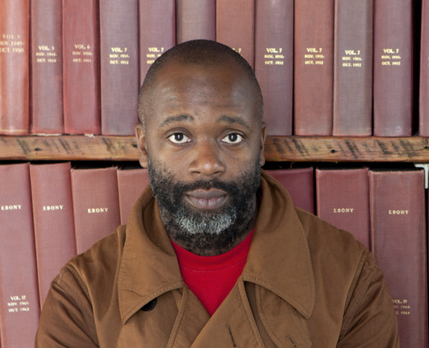 Theaster Gates with bound magazines from the Johnson Archive
