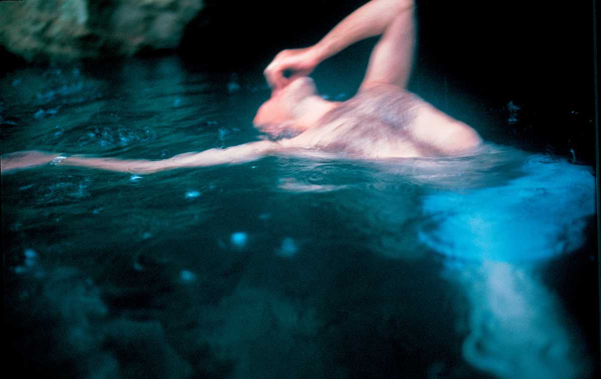Guido floating, Levanzo, Sicily, 1999, by Nan Goldin. One of our limited-edition prints