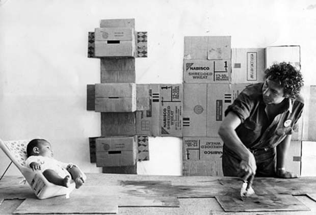 Rauschenberg in front of one of his Cardboard series, 1971. Photograph by Hans Namuth