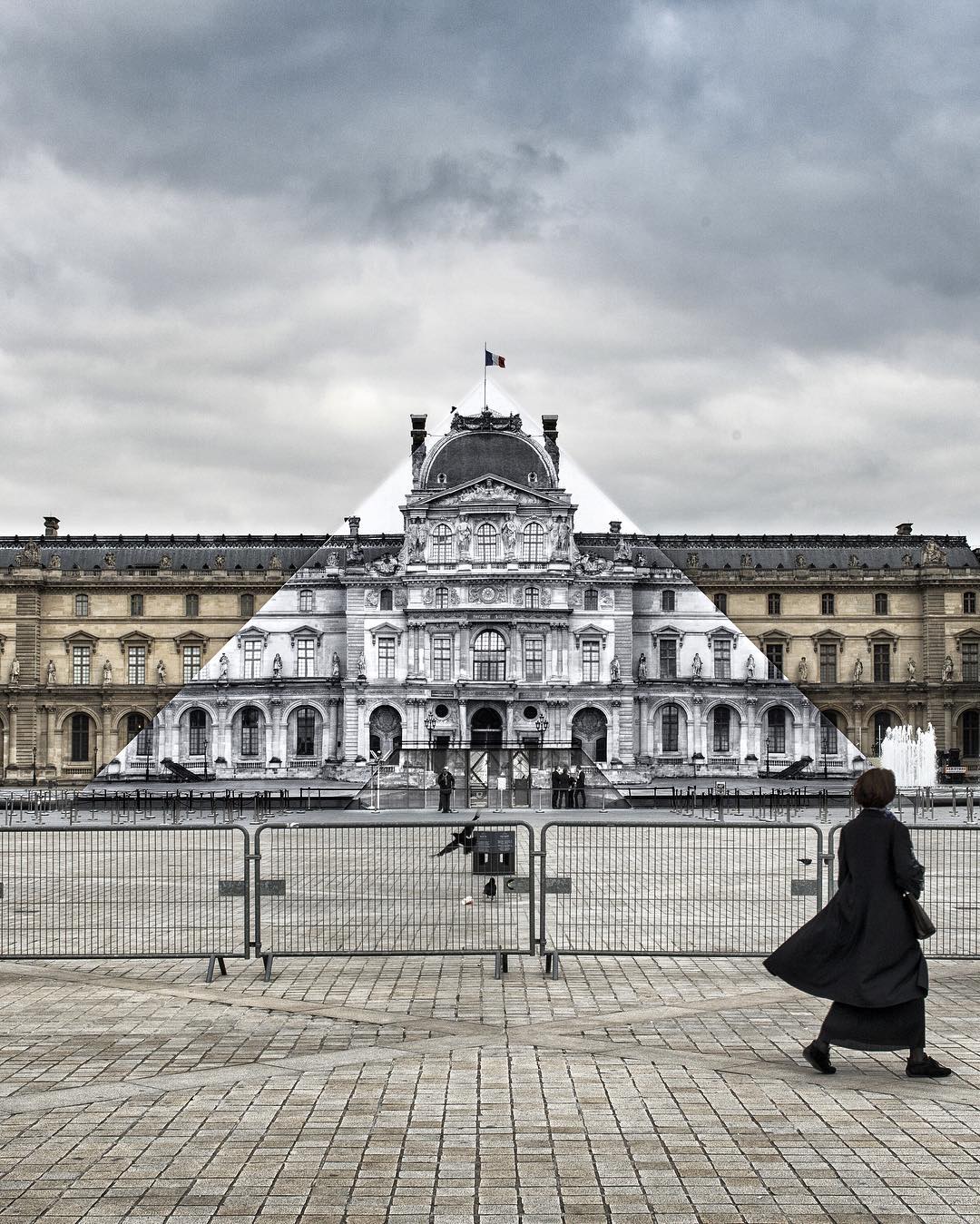 JR's pyramid wrap at the Louvre, Paris. Image courtesy of JR's Instagram