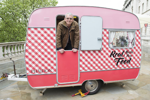 Martin Parr inside his Real Food van at Photo London, May 2016