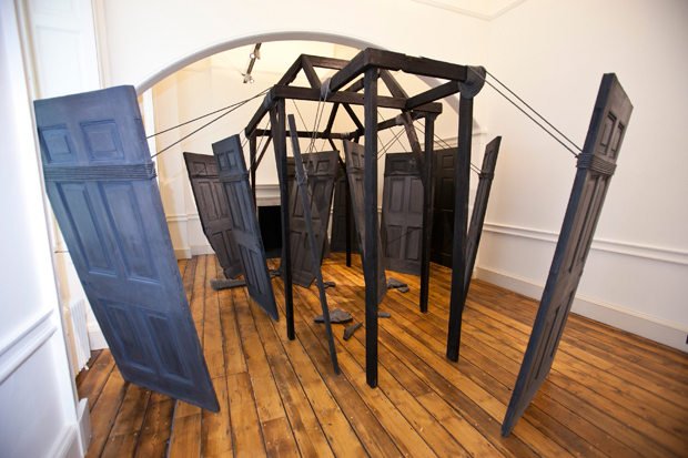 Nika Neelova, Partings (2012), concrete casts from a Somerset House door, burnt timber, rope, 4m x 3m approx