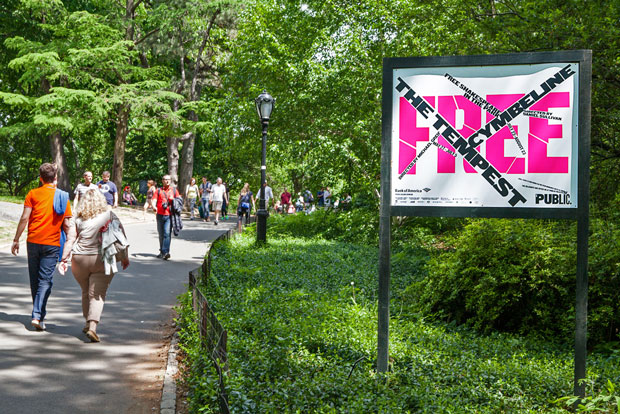 A poster from the new campaign on the path to the Delacorte Theater in Central Park. Photo by Claudia Mandlik. Courtesy of Pentagram