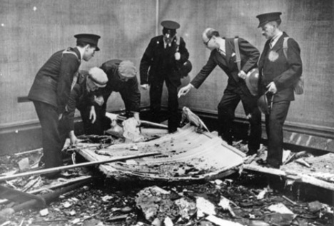 Tate Director John Rothenstein with Tate staff surveying the damage caused by a bomb which hit the Gallery on 16 September 1940. Image courtesy of The Tate
