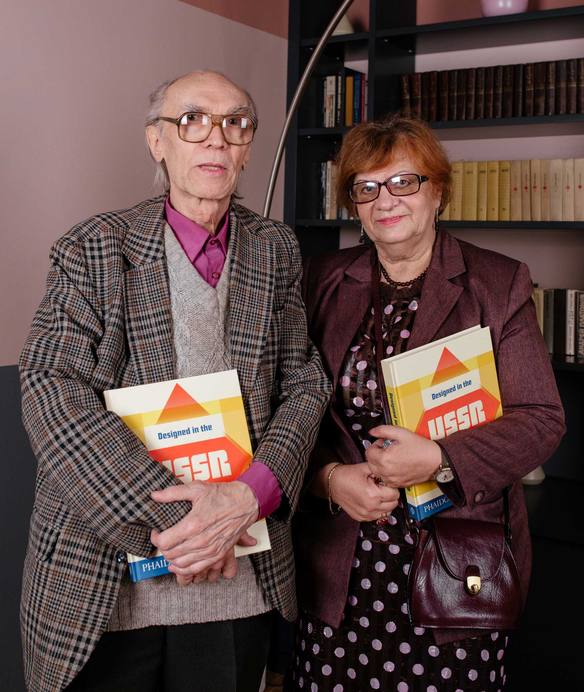 Two of the designers featured in Designed in the USSR: 1950-1989 holding a copy of the book photographed at the Tretiakov Gallery in Moscow last month Left: Alexander Grashin right unknown