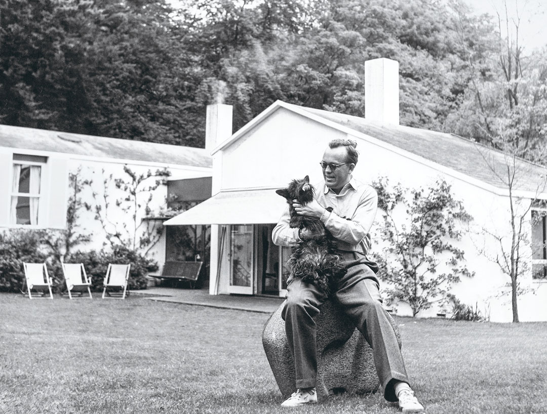 Juhl with the family dog, Bonnie, in the garden of his house at Kratvænget 15 in Ordrup, which he built himself in 1942