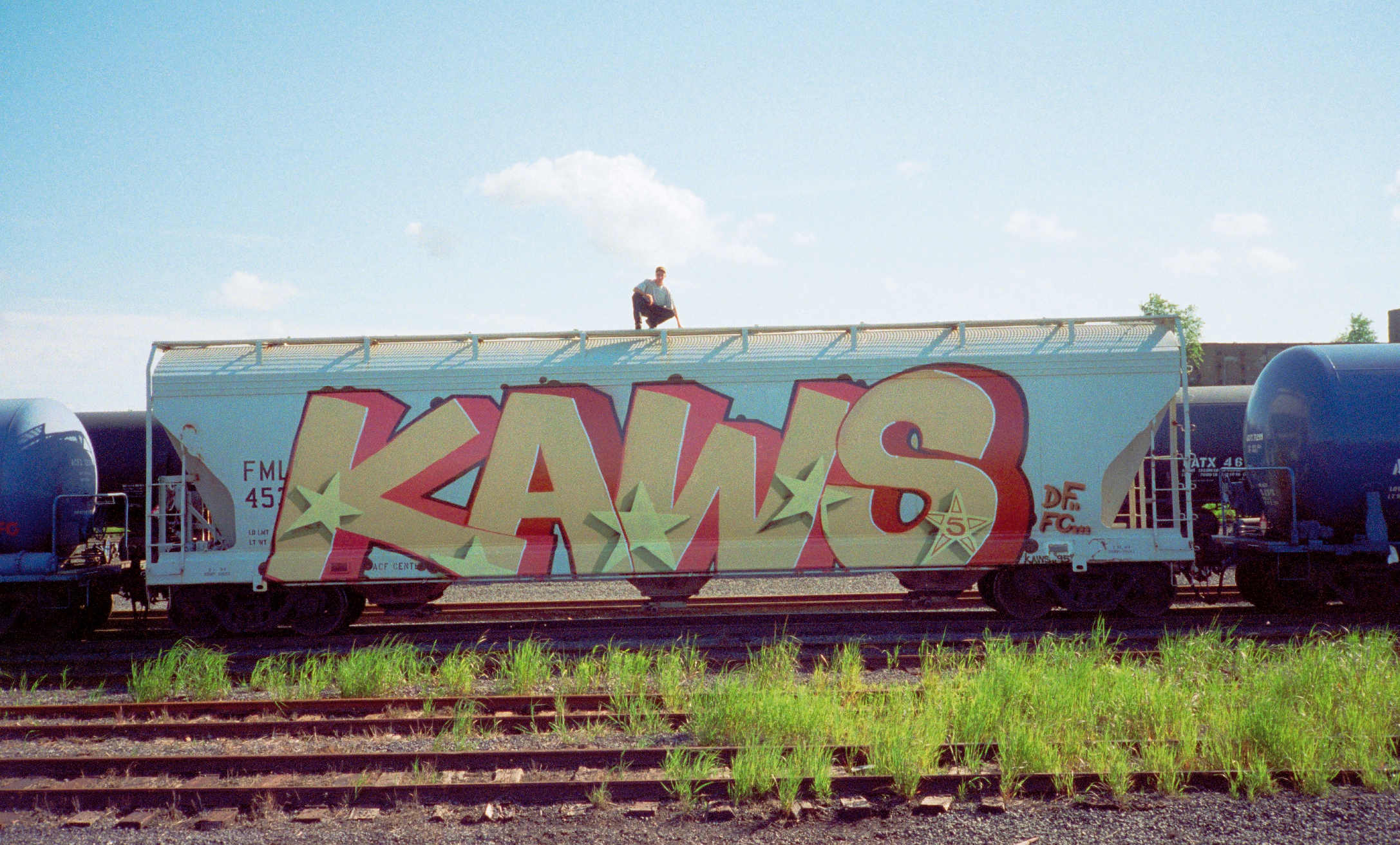 UNTITLED (KAWS), 1995, Spray paint on freight train, New Jersey / © KAWS 