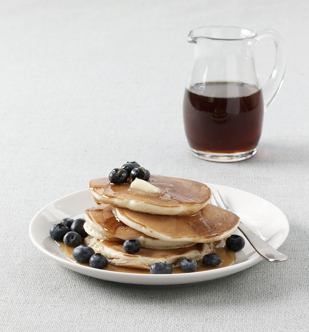 Buttermilk pancakes with blueberries and syrup, as featured in Simple & Classic