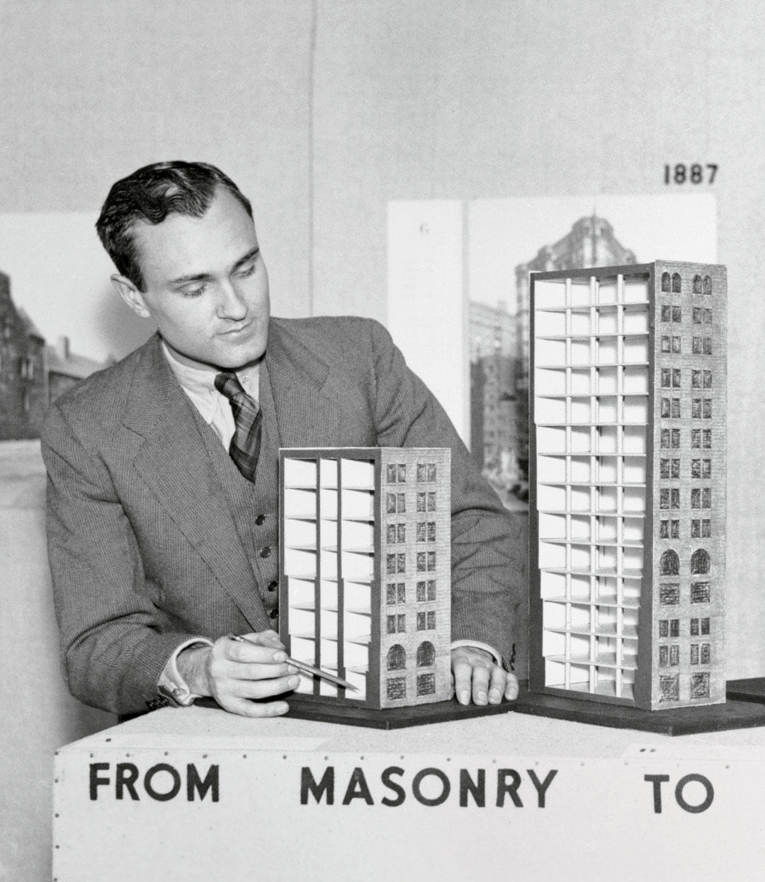 Philip Johnson with models demonstrating the evolution of the skyscraper from masonry to steel [detail]. Bettmann via Getty Images