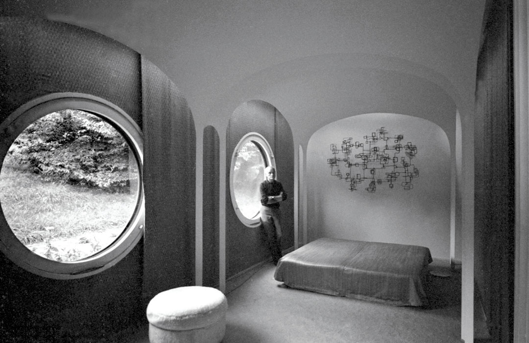 Philip Johnson in the Brick House, 1966. A welded metal sculpture hangs over the bed. Brick House, New Canaan, Connecticut, 1949. David McLane/NY Daily News via Getty Images