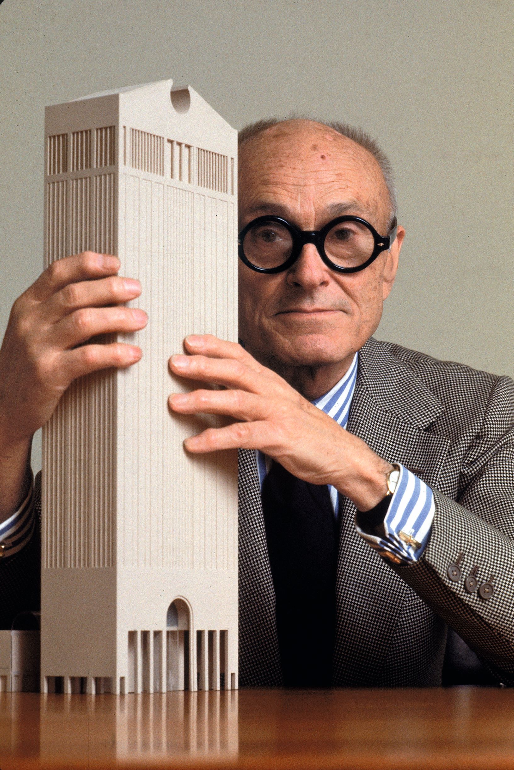 Philip Johnson posing with a model of his newly designed AT&T Building, May 1978