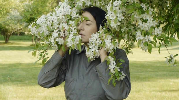 Marina demonstrates exercises in nature (still from a film by Noah Blumenson-Cook)