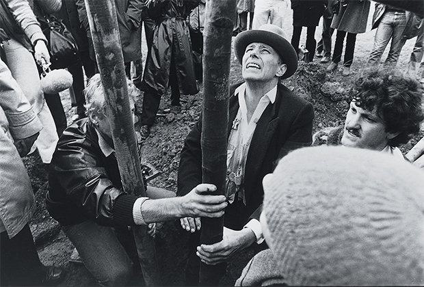Joseph Beuys planting the first tree; 7000 Oaks, Documenta VII, Kassel, 1982 