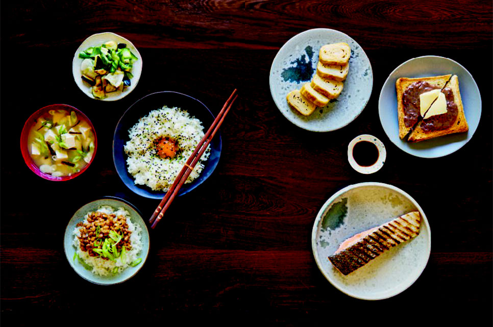 Clockwise from top left: quick pickled vegetables; rolled omelet; toast with sweet red bean spread; grilled fish; rice with natto; rice with raw eggs; miso soup, from the Japanese pages of Breakfast: The Cookbook