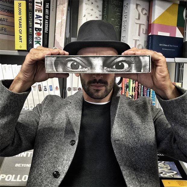 JR with his new book, JR: Can Art Change The World, Phaidon's London offices, Sept 2015